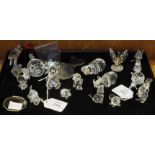 A collection of seventeen Swarovski and other small glass animals, includes whale, hippopotamus,