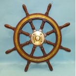 A teak and brass-mounted 8-spoke ship's wheel, 77cm diameter.