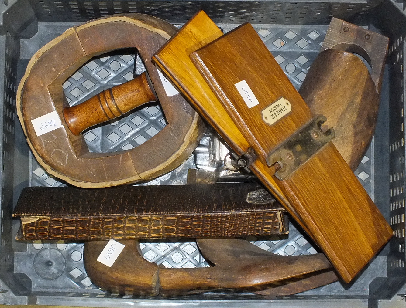 A wooden hat stretcher and other items.