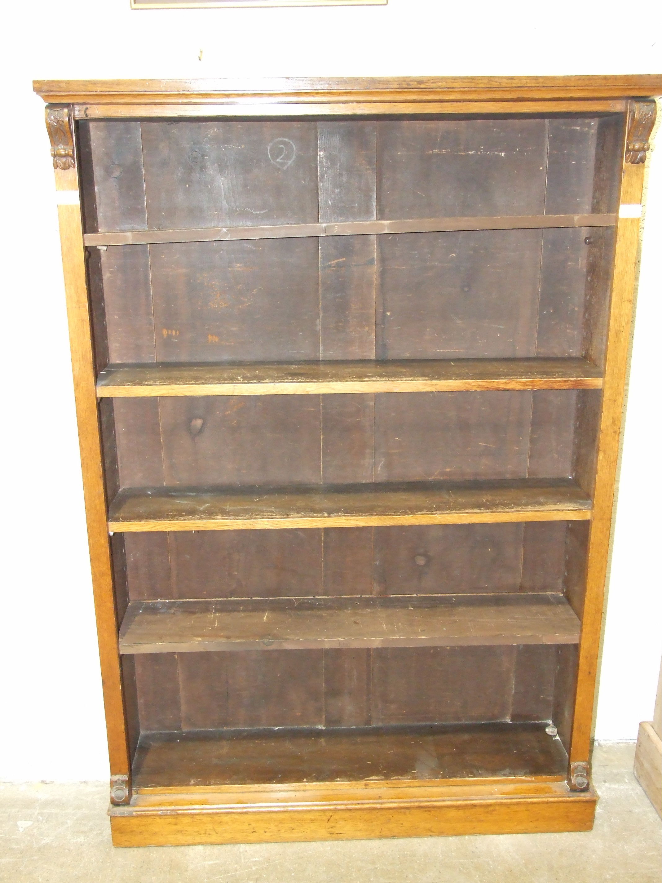An early-20th century mahogany open bookshelf with adjustable shelves, on plinth base, 104.5cm wide,