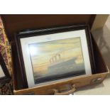 A leather suitcase, two framed coloured prints of 'The Titanic' and two reproduction British Rail