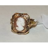 An unusual swivel ring with octagonal panel swivelling to show an oval shell cameo of a woman and an