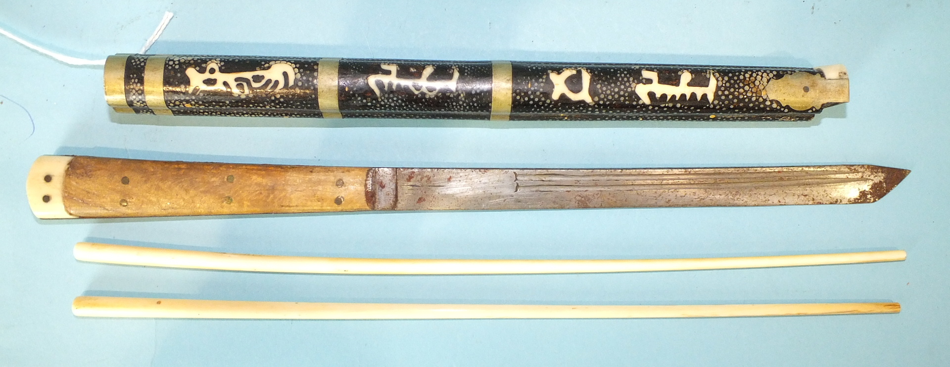 A Japanese metal-mounted shagreen-covered trousse containing bone chopsticks and knife (a/f), 30.5cm
