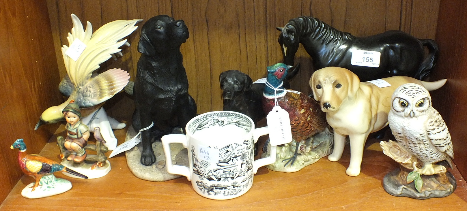 A Border Fine Art black Labrador bitch, sitting, 21cm high, a Beswick pheasant no.1226, a Beswick