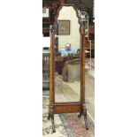A 20th century walnut-framed cheval mirror with arched plate and splayed legs, 47cm wide, 155cm