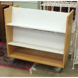 A 'Gresswell' metal three-tier book trolley, 91cm wide, 89cm high, a painted wooden freestanding