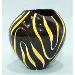 A late-20th century ceramic studio vase with yellow and cream stripe decoration on a black ground,