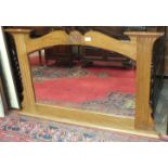 An Art Nouveau-style oak-framed wall mirror, 111cm wide, 72cm high, an oak work box fitted with a