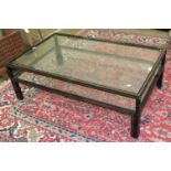 A modern rectangular black metal frame and glass two-tier coffee table, 125 x 74.5cm.