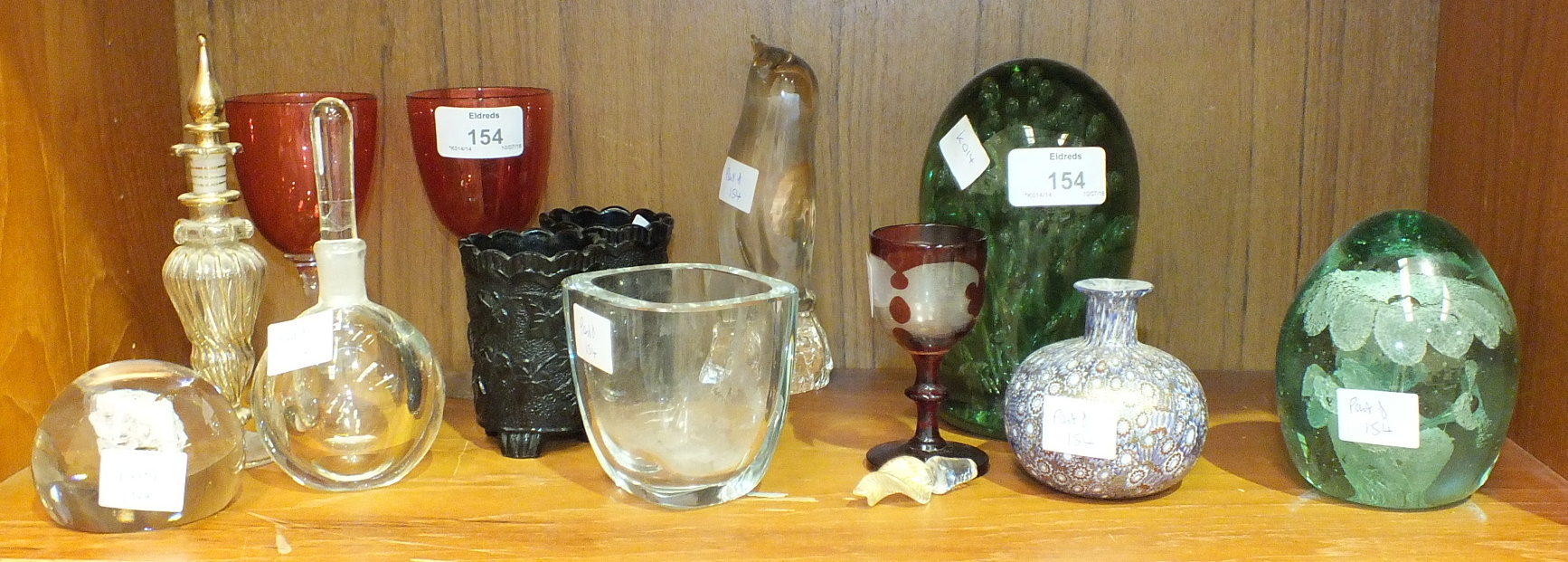 A Victorian glass dump with bubble inclusions, 14cm high, a similar smaller glass dump with flower