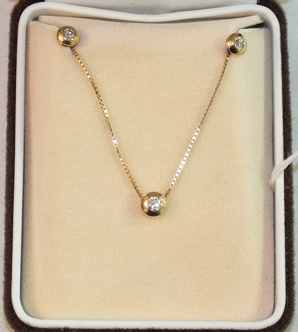 A modern 14k box-link neck chain with sliding pendant set diamond, in rubbed-over setting and a pair