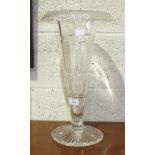 A large cut-glass trumpet shape vase with ribbed and hobnail decoration, on shaped circular base,