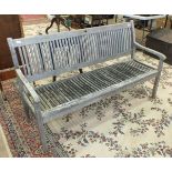A 'Trifon' weathered teak slatted-seat-and-back garden bench, 158cm wide.