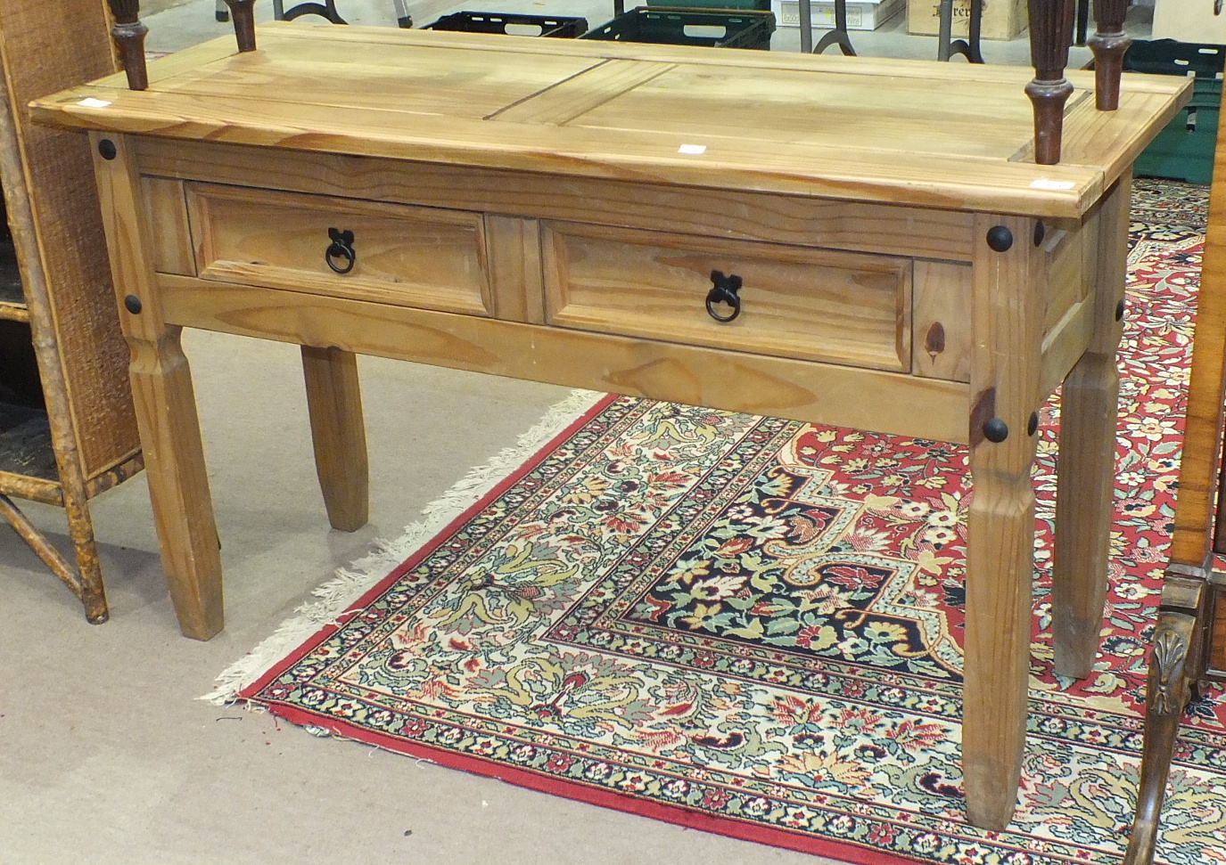 A modern pine rectangular-top side table fitted with two drawers on square legs, 126.5cm wide,