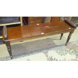 A reproduction Regency mahogany window seat with scroll ends, on turned and reeded supports, 121cm