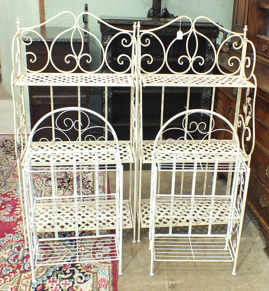 A pair of painted metal folding three-tier bookshelves, 62cm wide, 123cm high and a pair of