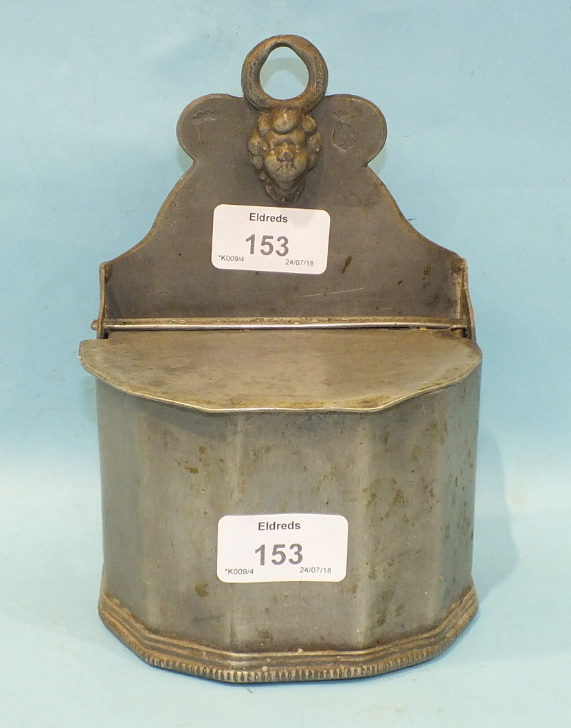 A 19th century pewter wall-mounted salt pig with mask hanging loop and touch marks, probably French,