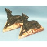 Two Art-Deco-style Verdigris spelter figures of greyhounds on pale marble plinths, 16cm high, 24cm