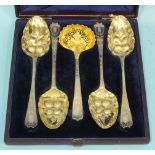 A cased set of four Georgian silver berry spoons with floral-engraved handles, maker PR, London.