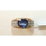 A 9ct gold ring set kyanite and diamond cluster, size O½, 4.2g.