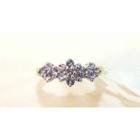 A 9ct gold tanzanite cluster ring, size Q½, 2.1g.