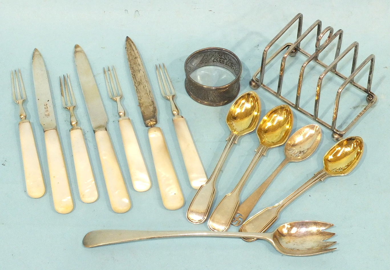 Nine silver bladed mother of pearl handled fruit knives, (one af), four matching fruit forks four