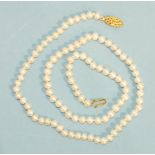 A modern necklace of uniform cultured pearls, 50cm long.