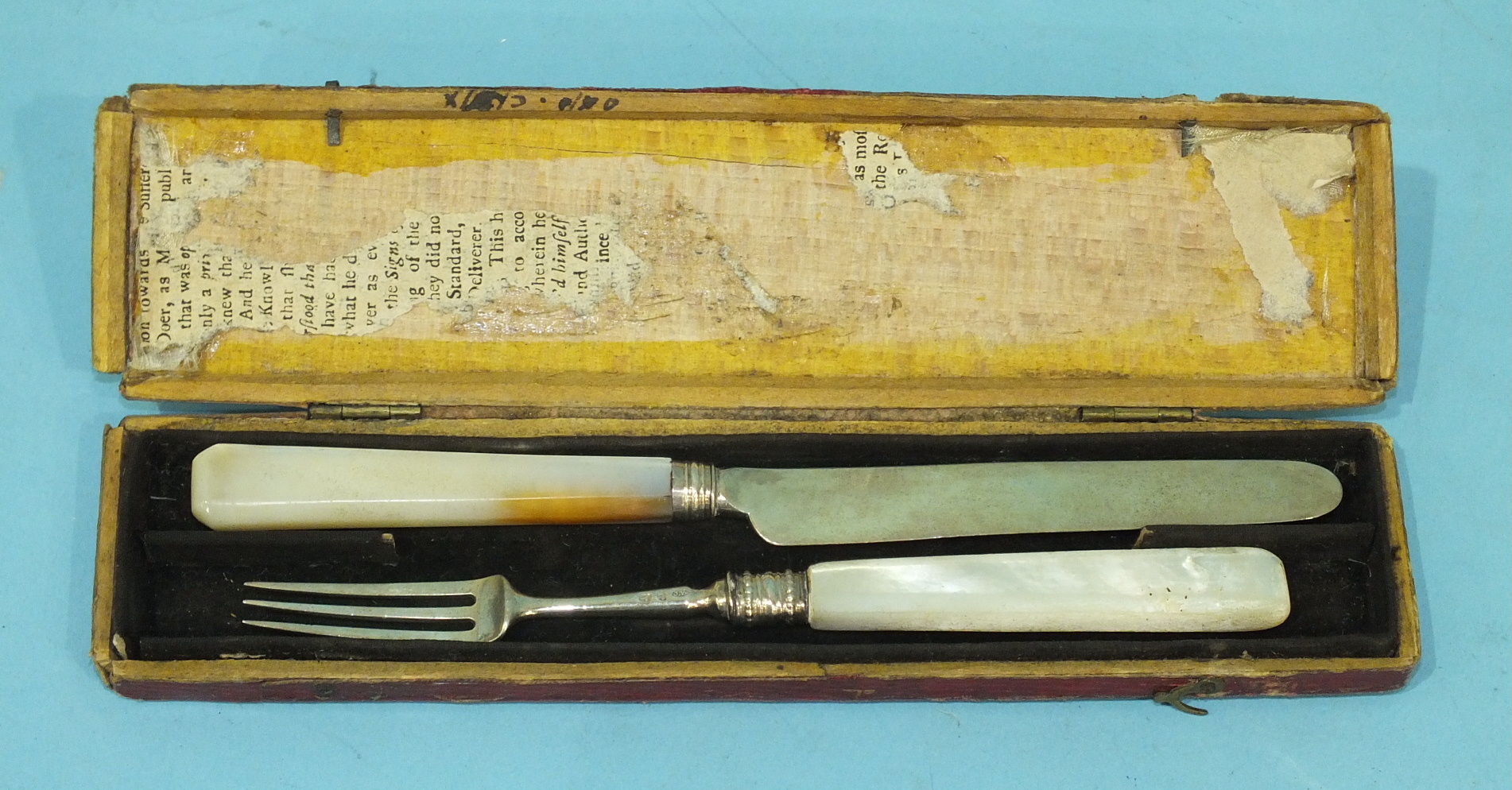A George III silver fruit knife and fork with mother-of-pearl handles, Birmingham 1808, maker JW, in