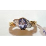 A tanzanite and diamond ring in 18ct gold mount, size P, 3.9g.