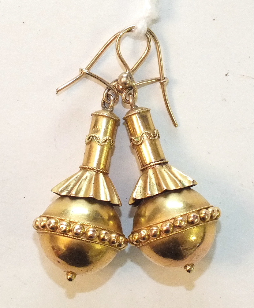 A pair of Victorian gold pendant earrings each in the form of a ball with beaded band around the