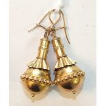 A pair of Victorian gold pendant earrings each in the form of a ball with beaded band around the