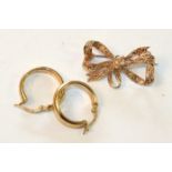 A 9ct gold bow brooch and a pair of 9ct gold earrings, 5.3g.