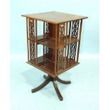 An Edwardian cross-banded mahogany revolving bookcase, 43cm.