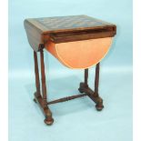 An Early-Victorian mahogany work and games table, the shaped top with two small drop leaves and