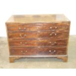 A Georgian mahogany chest of four graduated cockbeaded drawers and brushing slide, on bracket