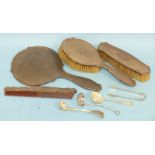 A silver four-piece dressing table set, comprising mirror, two brushes and a comb, with engine-