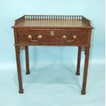 A good quality mahogany side table in the Chippendale taste, the rectangular galleried top above a