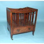 A Late-Georgian mahogany rectangular music Canterbury, the four divisions above a drawer, on ring-