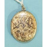 A Victorian oval "Mizpah" locket with engraved floral and heart decoration, 32 x 27mm, 9.4g.