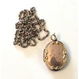 A 9ct gold locket on a 9ct gold belcher-link chain, 8.8g.
