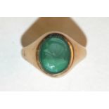 A modern 9ct gold signet ring set carved intaglio, size R, 3.7g.