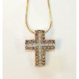 A modern 9ct gold cross pendant set white and brown diamonds, on 9ct gold chain, 5.8g.