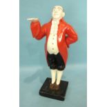 A 20th century dumb waiter in the form of a painted wood figure of a portly gentleman in red