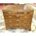 A Georgian mahogany bachelor's chest, the brushing slide above two short and three long moulded-edge