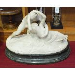 After Canova, a 19th century carved alabaster group 'Cupid and Psyche', raised on green marble