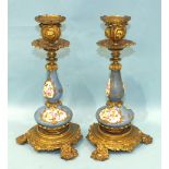 A pair of 19th century gilt metal and porcelain candlesticks, each gilt metal sconce and bottle-form