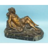 A 19th century gilt bronze reclining female figure on a natural base and green marble plinth, 21cm
