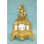 A 19th century gilt brass French mantel clock surmounted by a military figure and armour above the