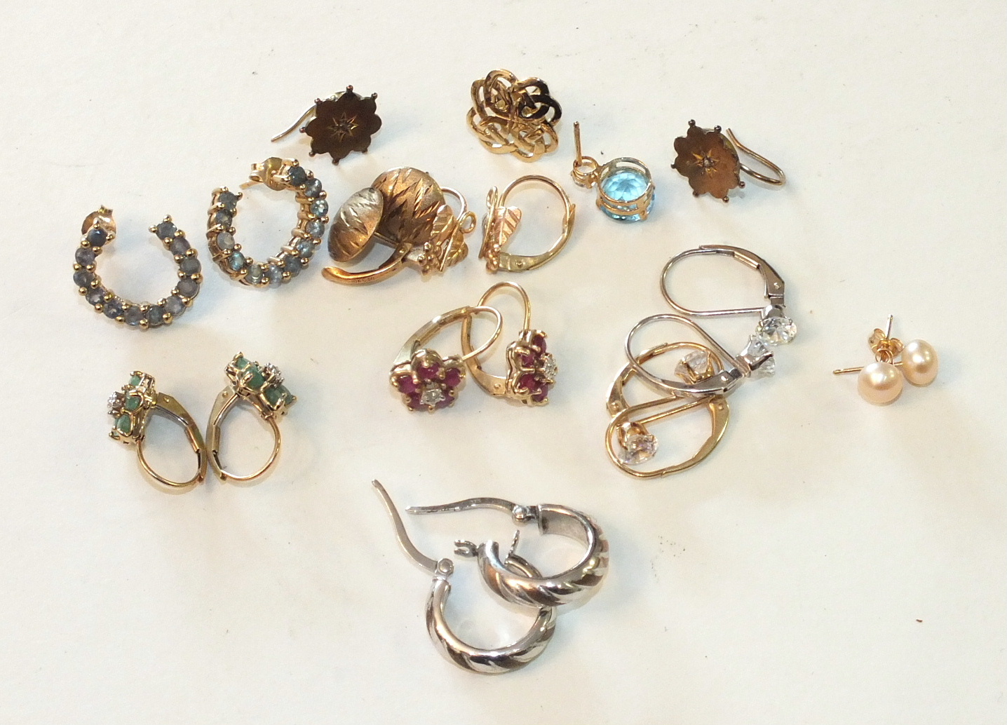 A quantity of earrings, mainly-marked for 9ct gold, some gem-set, total weight 14g.