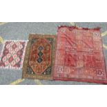 A Persian rug with triple pole medallion on brick red ground and blue spandrels, 87 x 133cm and
